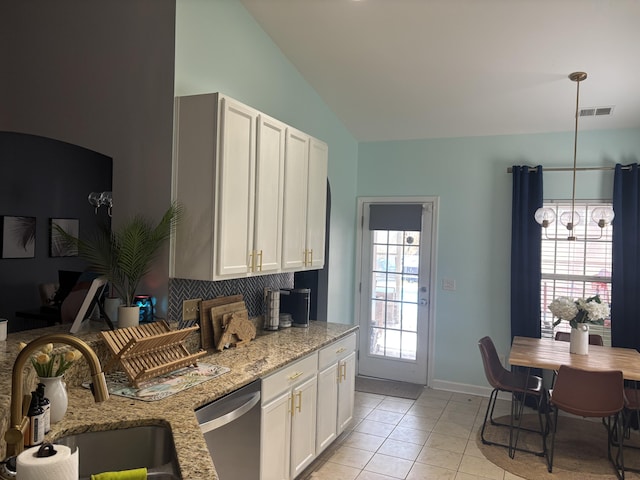 kitchen featuring decorative light fixtures, white cabinetry, dishwasher, sink, and light stone countertops