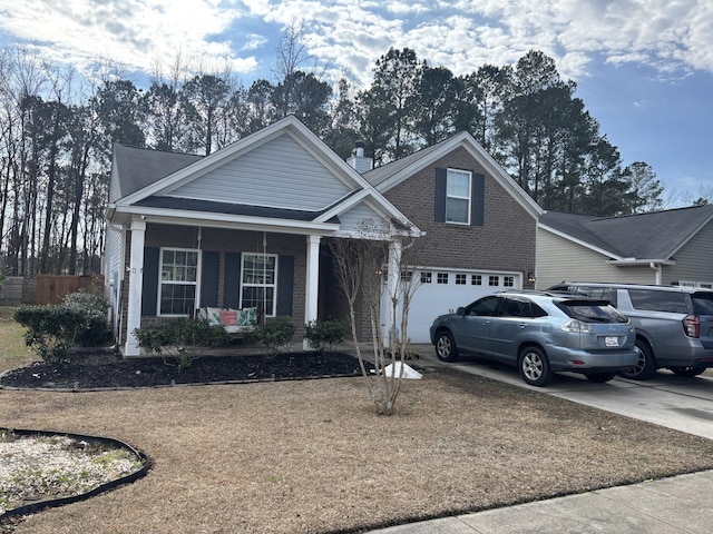 front facade with a porch and a garage