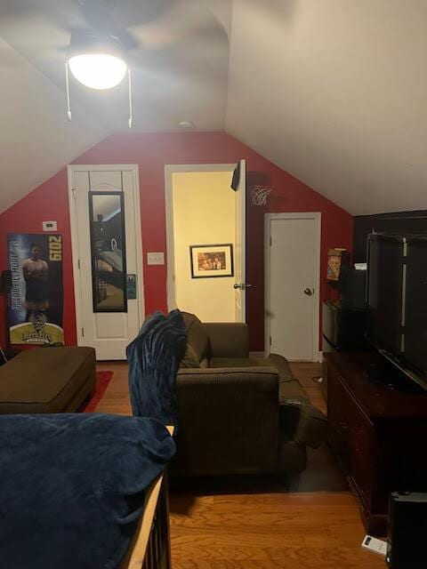 interior space with lofted ceiling and light wood-type flooring