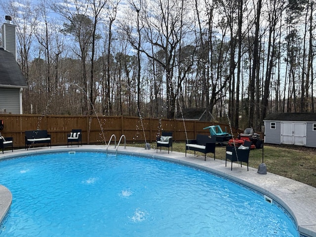 view of swimming pool featuring a shed