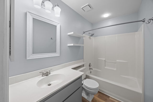 5488 Altamaha Dr, North Charleston, SC 29420 - full bathroom with vanity, toilet, washtub / shower combination, and wood finished floors