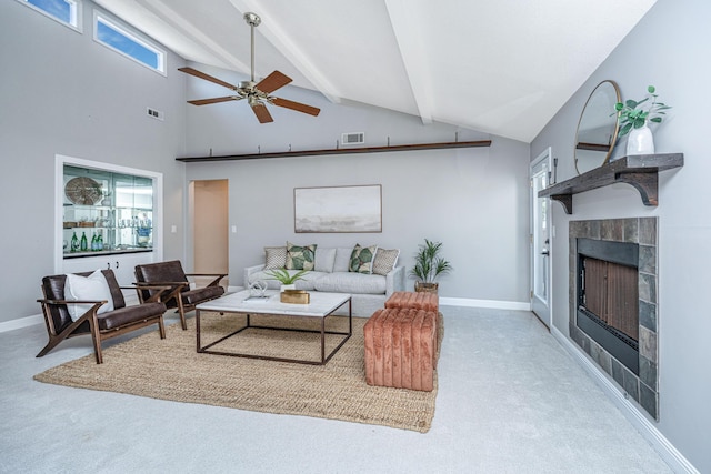 living area featuring visible vents, a fireplace, baseboards, and carpet