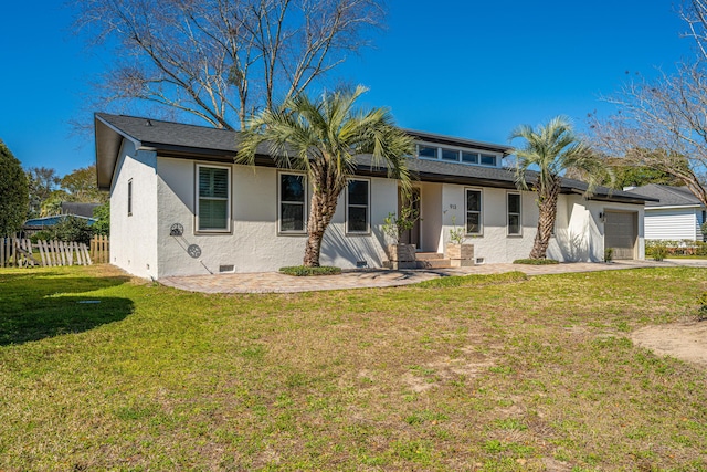 back of property featuring crawl space, a garage, stucco siding, and fence