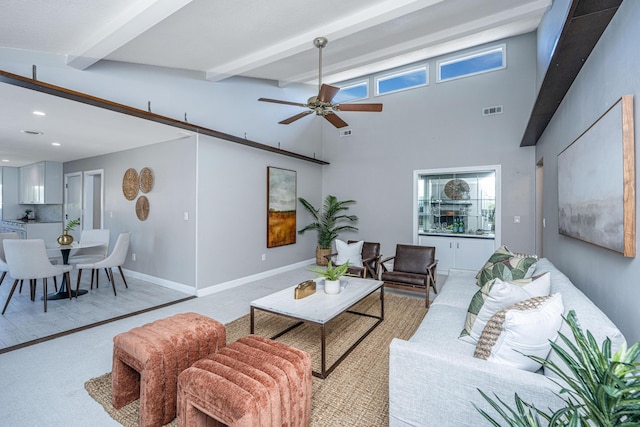 living room featuring baseboards, visible vents, recessed lighting, ceiling fan, and beamed ceiling