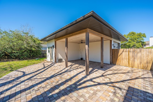 view of patio / terrace with fence and ceiling fan