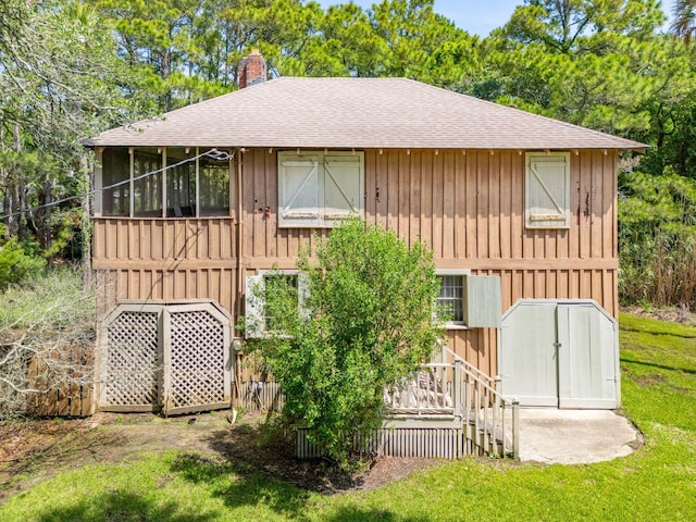 back of house with a yard