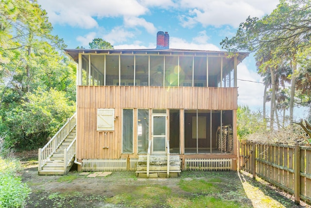 rear view of house with a sunroom