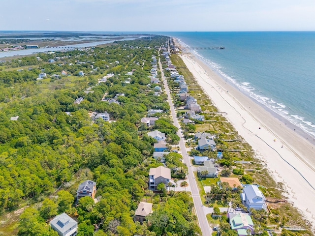 birds eye view of property with a water view and a view of the beach