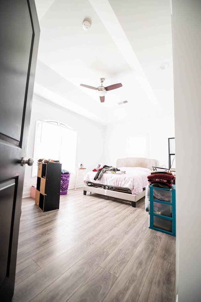 bedroom featuring hardwood / wood-style flooring and ceiling fan