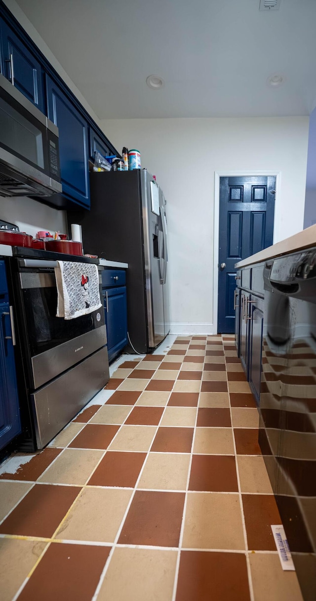 kitchen featuring stainless steel appliances and blue cabinetry