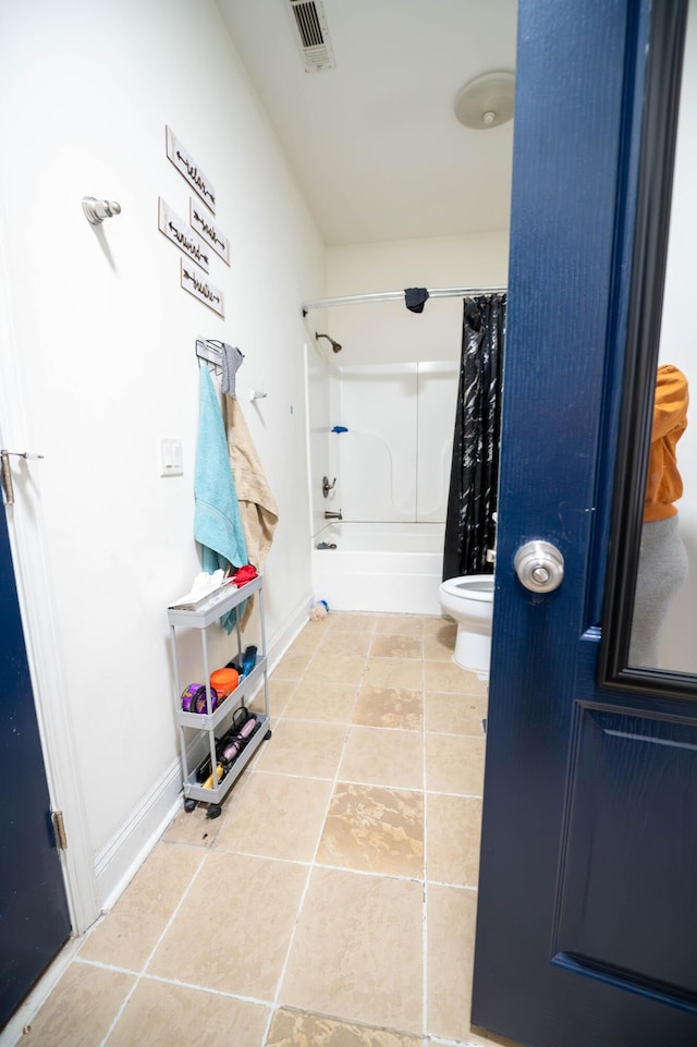 bathroom with toilet and shower / bathtub combination with curtain