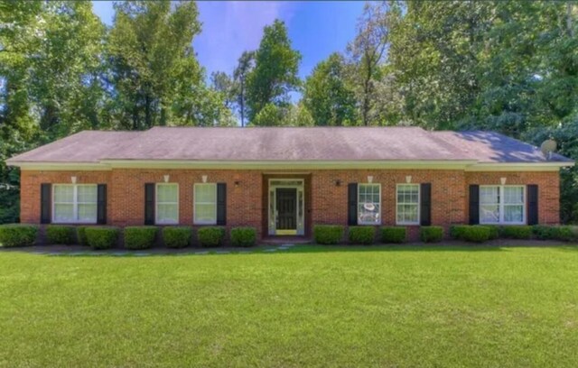 ranch-style house with a front lawn