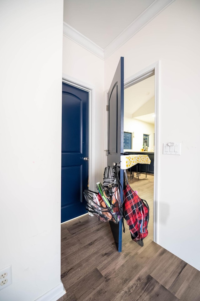 corridor with crown molding and hardwood / wood-style floors