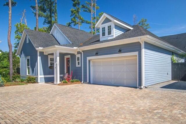 1641 Adventure Xing, Mount Pleasant, SC 29466 - view of front facade with a porch, an attached garage, and decorative driveway