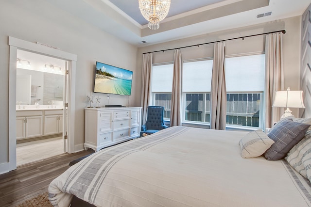 1641 Adventure Xing, Mount Pleasant, SC 29466 - bedroom with a tray ceiling, wood finished floors, a chandelier, ensuite bath, and crown molding