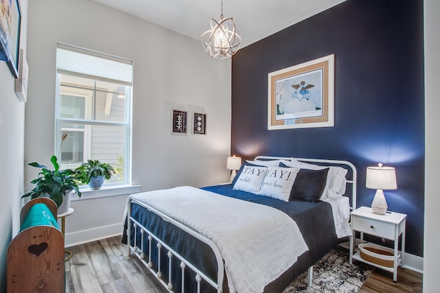 1641 Adventure Xing, Mount Pleasant, SC 29466 - bedroom featuring wood finished floors, multiple windows, and a chandelier