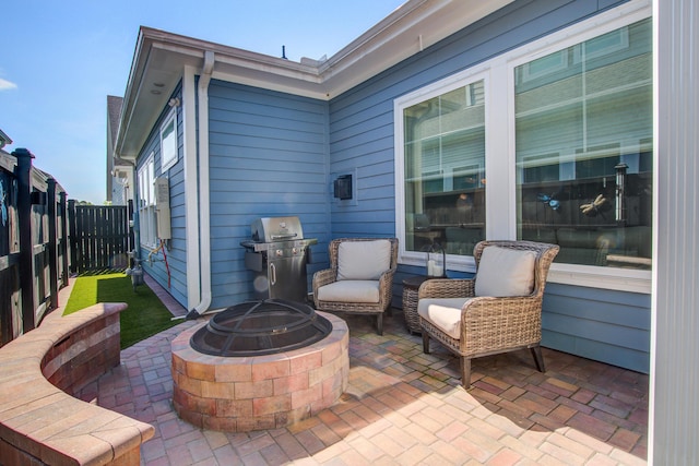 1641 Adventure Xing, Mount Pleasant, SC 29466 - fenced backyard with grilling area, a fire pit, and a patio