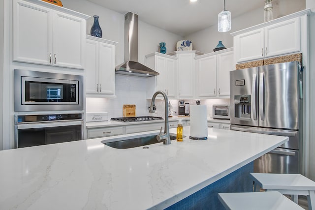 1641 Adventure Xing, Mount Pleasant, SC 29466 - kitchen with stainless steel appliances, wall chimney exhaust hood, tasteful backsplash, and white cabinets