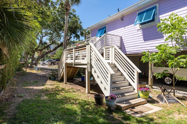 back of property with stairway and a deck