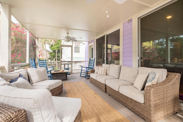 deck with a ceiling fan and an outdoor hangout area