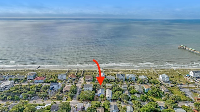 drone / aerial view with a residential view and a water view