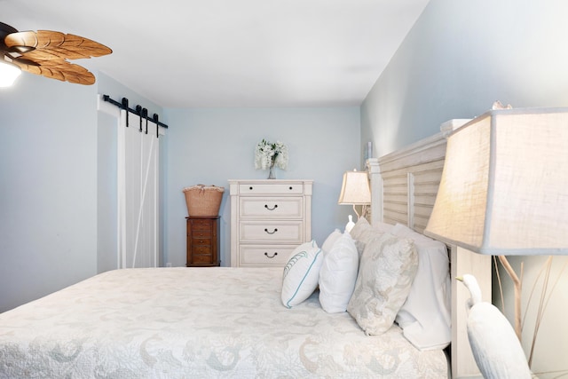 bedroom with a barn door