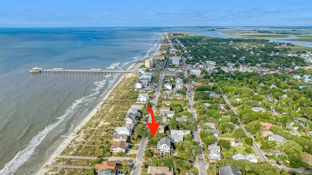 birds eye view of property featuring a water view, a view of the beach, and a residential view