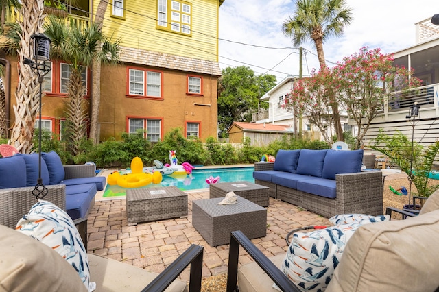 view of patio with a fenced in pool and outdoor lounge area
