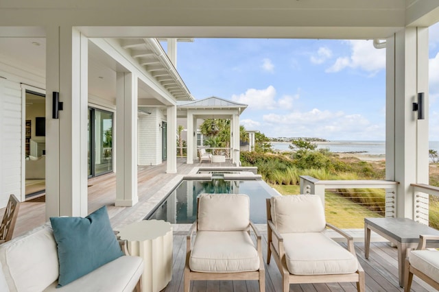 sunroom / solarium featuring a water view and a wealth of natural light