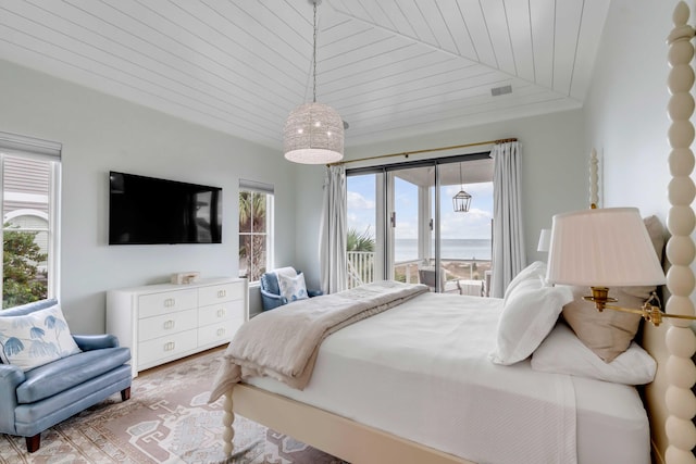 bedroom featuring hardwood / wood-style floors, access to exterior, wooden ceiling, and vaulted ceiling