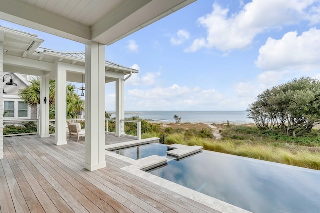 wooden deck featuring a water view