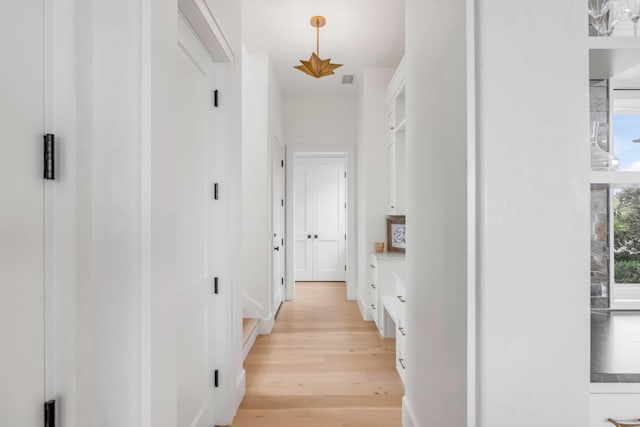 hallway featuring light hardwood / wood-style flooring