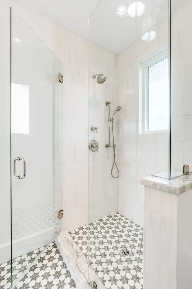 bathroom with an enclosed shower