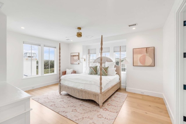 bedroom featuring light hardwood / wood-style floors and ceiling fan