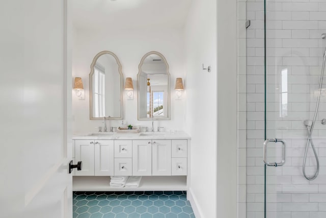 bathroom featuring tile patterned floors, vanity, and an enclosed shower