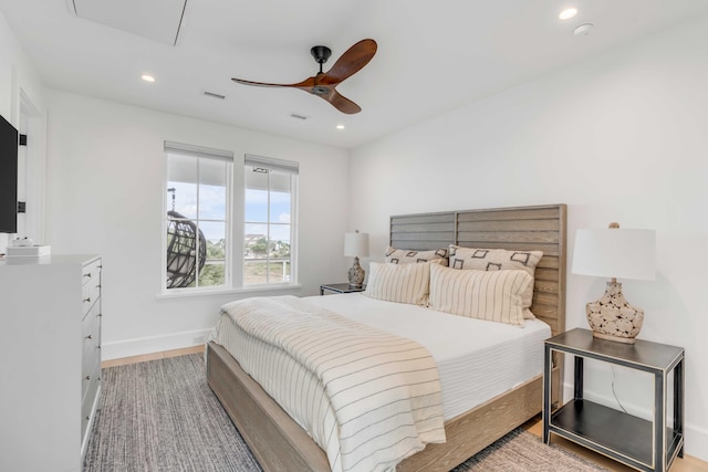 bedroom featuring light wood-type flooring and ceiling fan