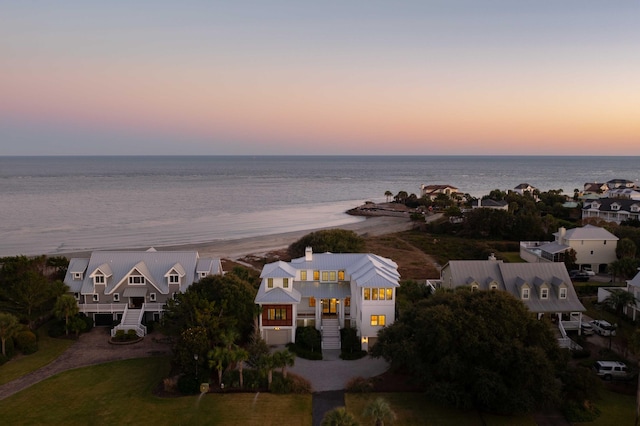 aerial view at dusk with a water view