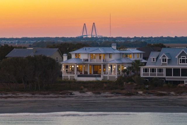 view of front of house with a balcony and a porch