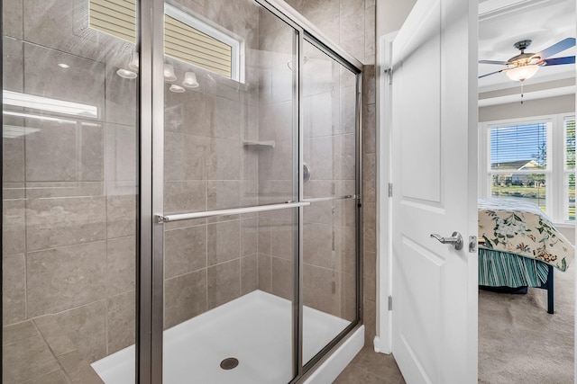 bathroom with ceiling fan and a shower with shower door