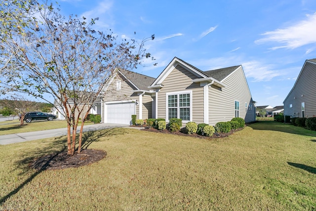 view of front of house featuring a garage and a front lawn