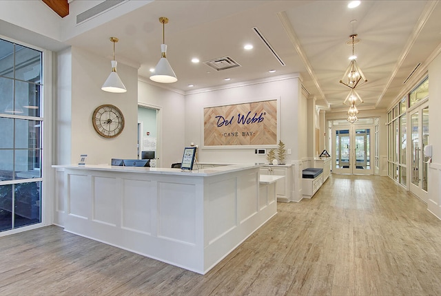 reception area with a chandelier and french doors