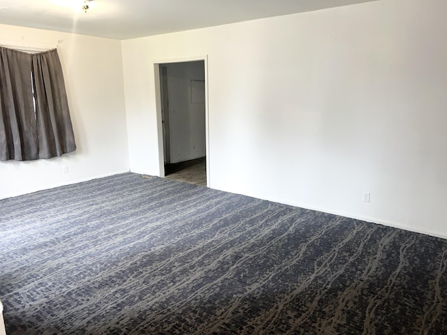 spare room with carpet