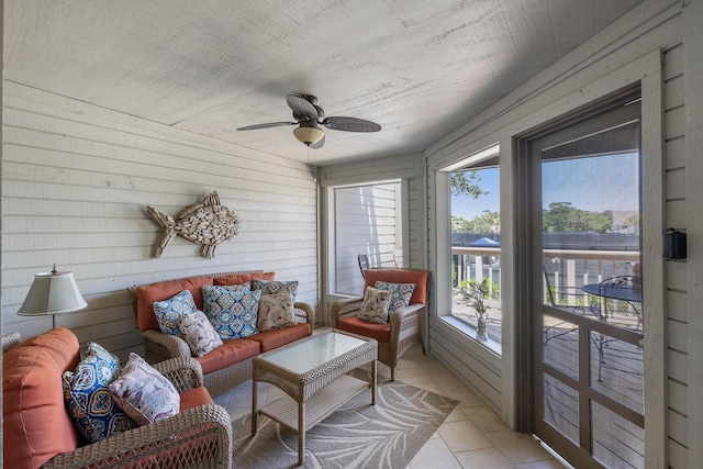 1605 Live Oak Park, Seabrook Island, SC 29455 - sunroom with a ceiling fan, an outdoor living space, tile patterned floors, and wood walls
