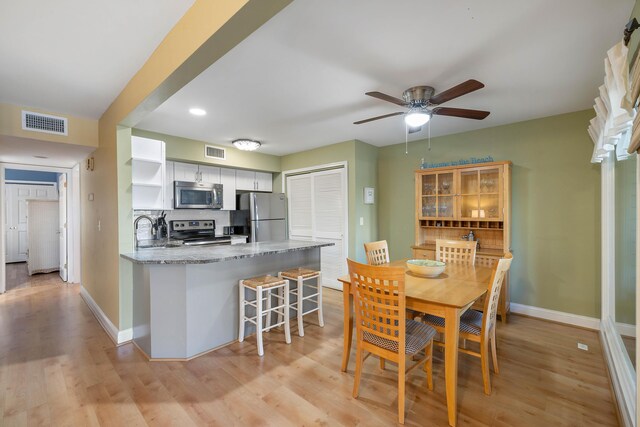 1605 Live Oak Park, Seabrook Island, SC 29455 - dining space with baseboards, ceiling fan, and light wood-type flooring