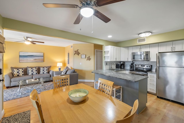 1605 Live Oak Park, Seabrook Island, SC 29455 - dining space with a ceiling fan and light wood-type flooring