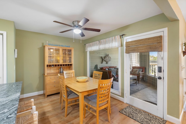1605 Live Oak Park, Seabrook Island, SC 29455 - dining space with light wood-style flooring, ceiling fan, and baseboards