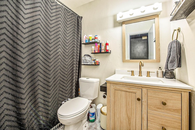 bathroom with vanity, curtained shower, and toilet