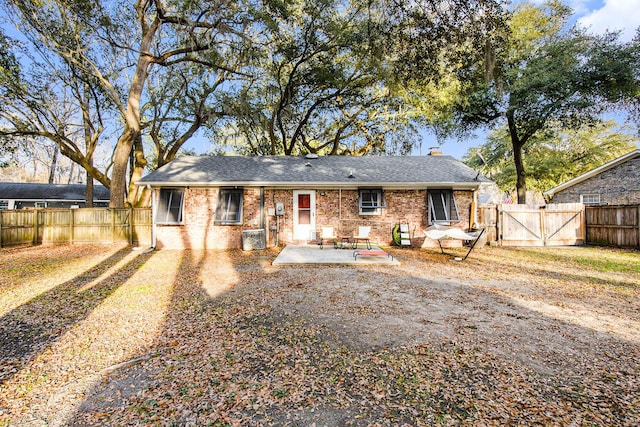 rear view of house with a patio and central air condition unit