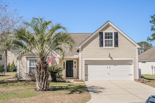 traditional home with concrete driveway and a garage