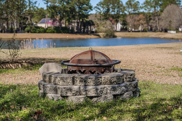 view of water feature with an outdoor fire pit